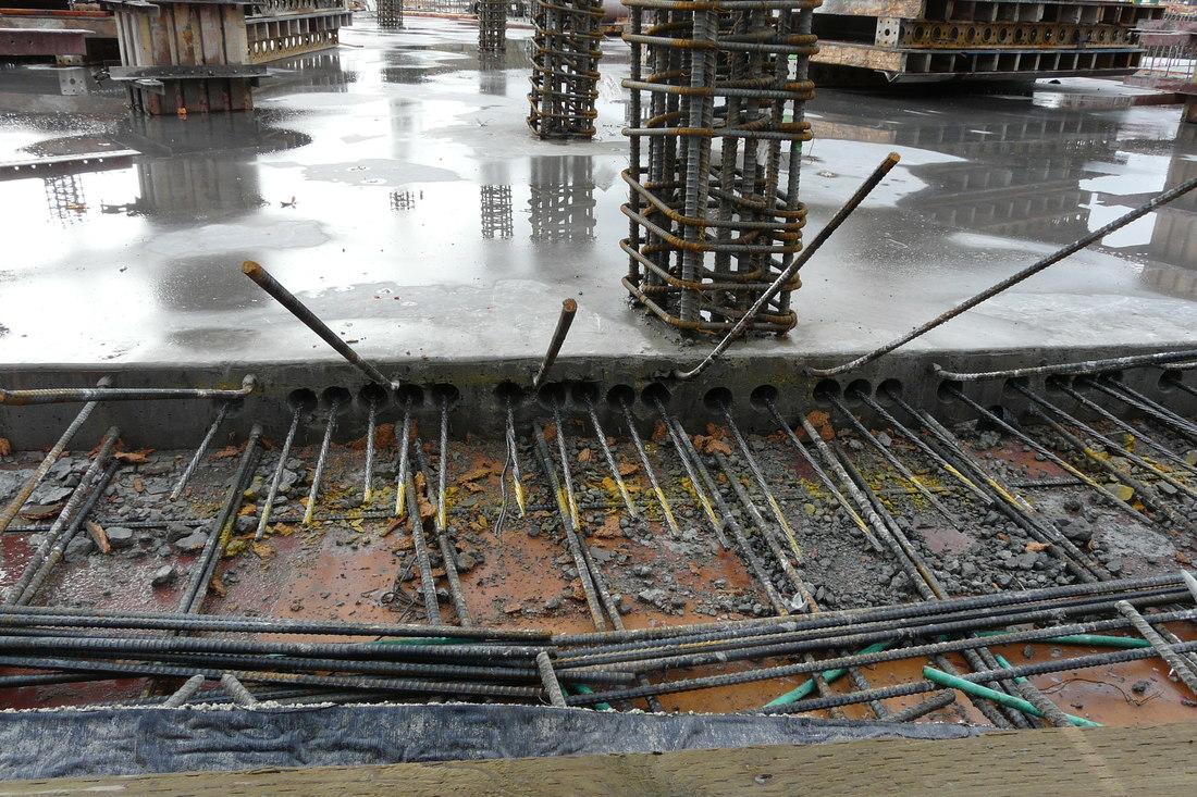 Crew placing and screeding a commercial concrete pour